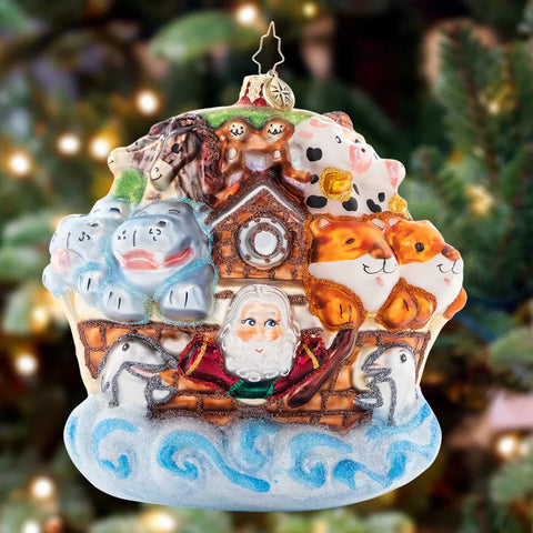 Christmas ornament featuring Santa in a sleigh, surrounded by various animals