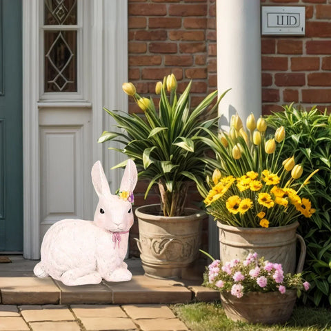 Easter bunny, and spring flowers decor in front of the house.