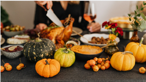 Pumpkins and other Thanksgiving decor for Thanksgiving dinner.