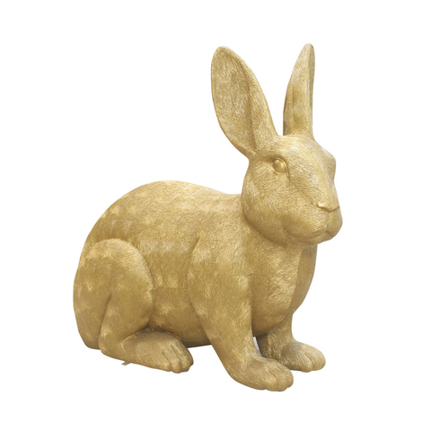 A gold-tone sculpture of a rabbit sitting upright with long ears and detailed texturing.