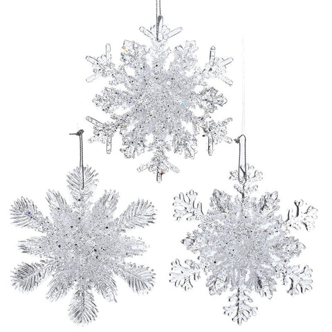 Three ornaments in shape of snowflakes