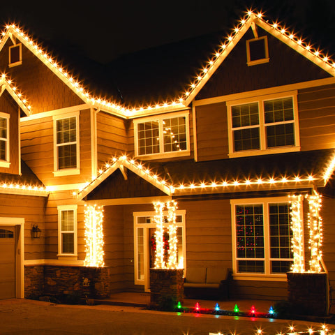 A house decorated with warm outdoor Christmas lights