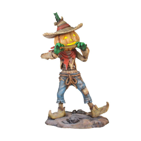 Pumpkin Scarecrow Playing Harmonica