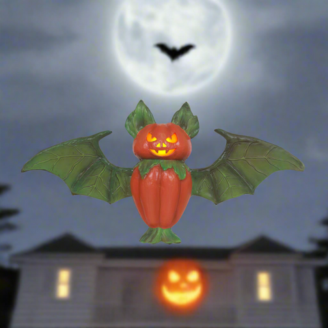 Pumpking bat statue in front of house