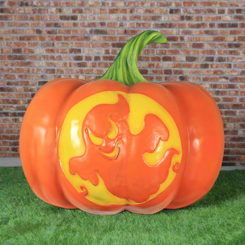 Pumpkin with a grinning ghost design in yellow.