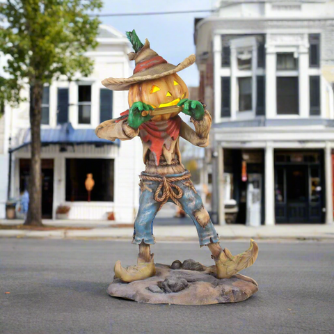 Pumpkin Scarecrow Playing Harmonica