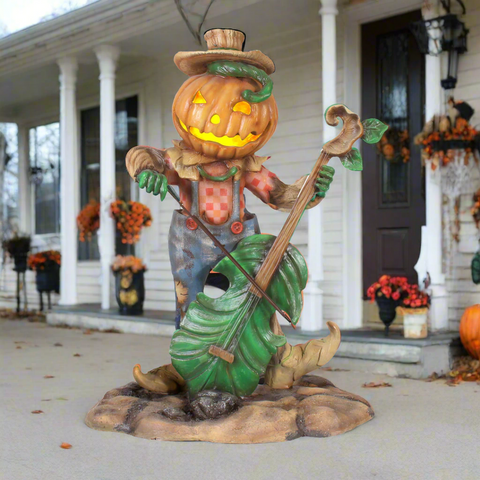 Pumpkin Scarecrow Playing Harmonica